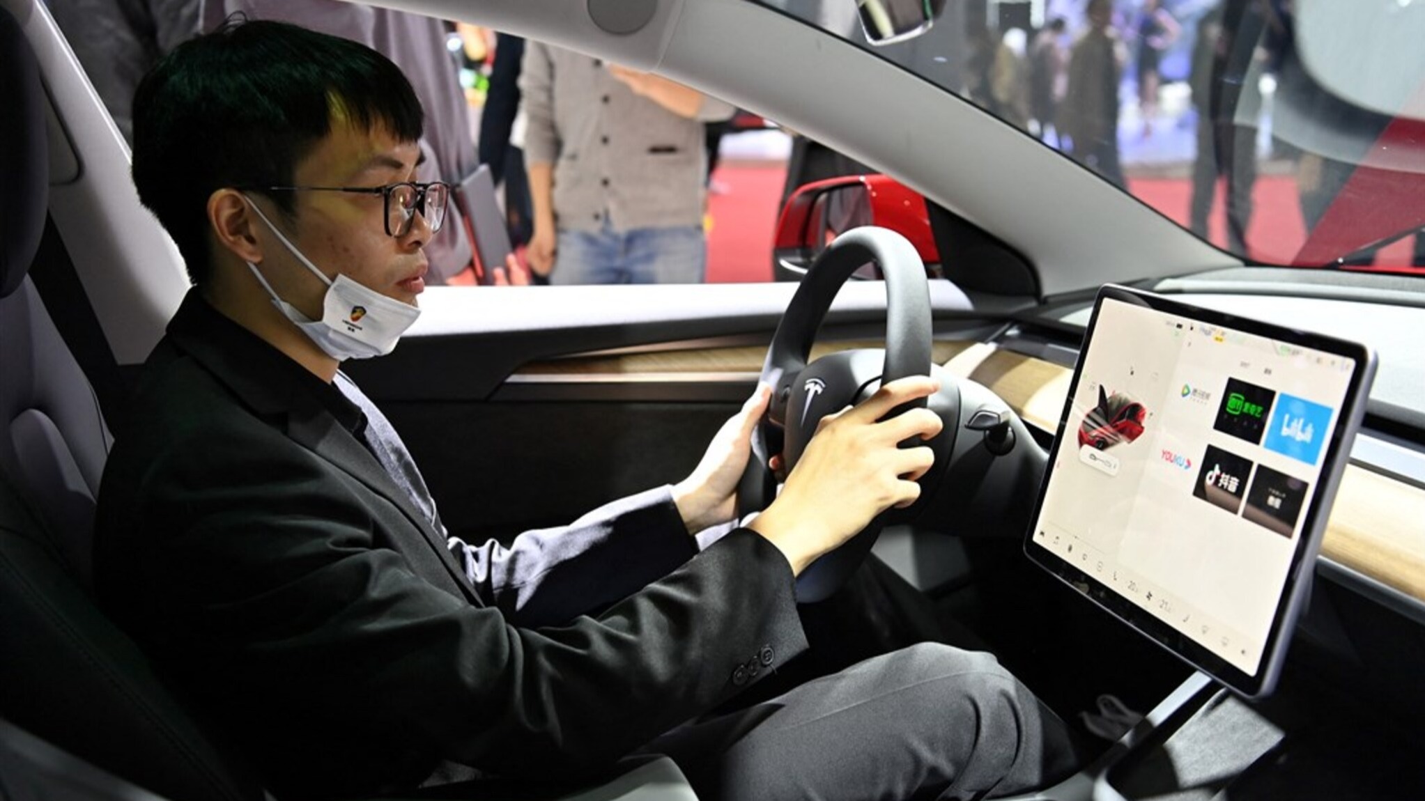 Tesla disables game function while driving.